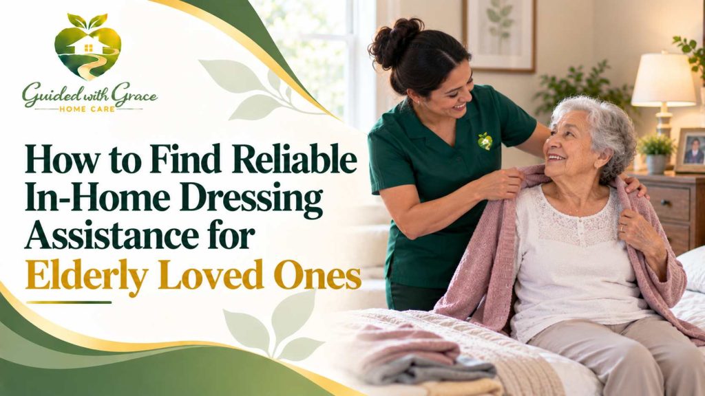 Caregiver helping a seated elderly woman button her cardigan in a bright bedroom